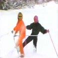 John Denver singing on skis